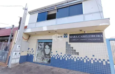 Sobrado com loja comercial e residencia com 3 dormitorios nos fundos na av. a j renner.