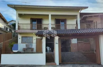 Casa a venda no bairro primavera em novo hamburgo/rs, 3 dormitórios sendo 1 suíte, aceita financiamento bancário.