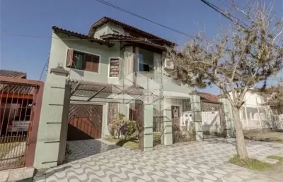 Casa com 4 quartos à venda na Rua Doutor Telmo Vergara, 556, Partenon, Porto Alegre