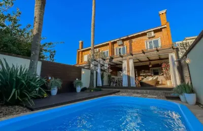 Casa de 3 suítes e 4 vagas de garagem bairro chácara das pedras