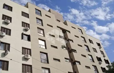 Amplo apartamento de 2 dormitórios com sacada, churrasqueira e lareira.