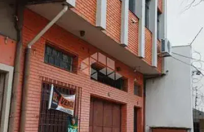 Prédio residencial e comercial de dois pisos com área de 410m² privativos e localizado próximo ao supermercado zaffari ipiranga.