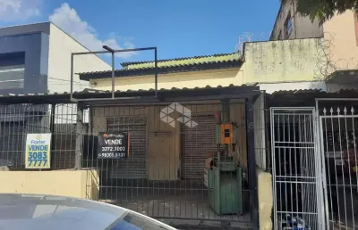 Terreno com duas lojas comerciais e dois apartamentos jk medianeira