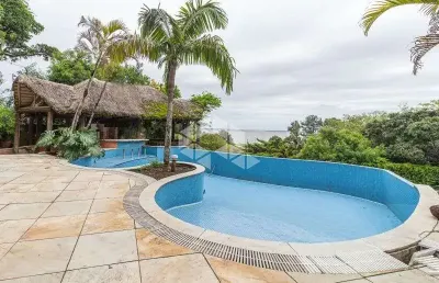 Casa com 4 quartos à venda na Rua Bororó, 301, Vila Assunção, Porto Alegre