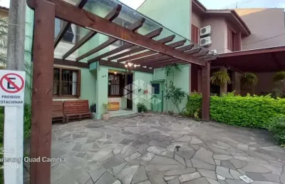 Casa em condomínio fechado com 3 quartos à venda na Avenida Juca Batista, 4095, Hípica, Porto Alegre