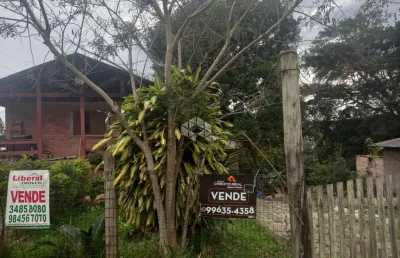 Casa com 4 quartos à venda na rua ernesto da fontoura, 836, tarumã, viamão, 577 m2 por r$ 300.000