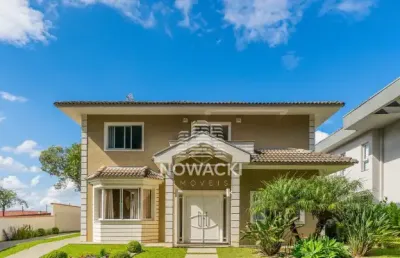 Excelente casa em condomínio com 4 quartos e 5 vagas no santa felicidade!
