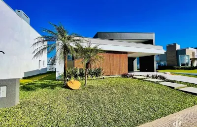 Casa em condomínio fechado dispondo de 04 suítes em tramandaí rs