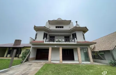 Casa grande com 7 dormitórios próxima a praia de tramandaí