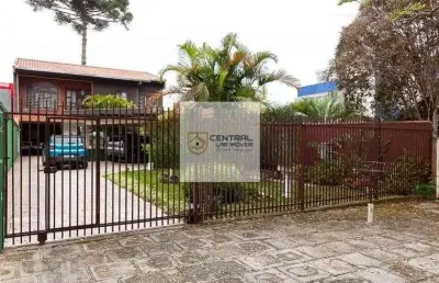 Sobrado  no  bacacheri, 2 suites, 6 quartos sendo 2 no térreo.