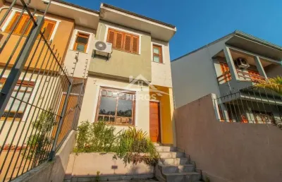 Casa com 3 quartos à venda na rua ilari arlindo basei, 62, guarujá, porto alegre por r$ 490.000