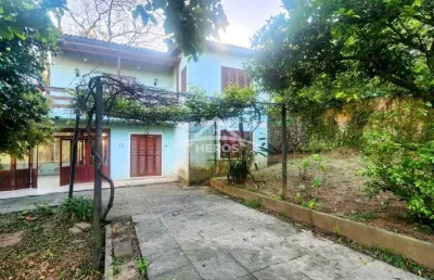 Casa com 4 quartos à venda na rua monte claro, 74, hípica, porto alegre por r$ 470.000
