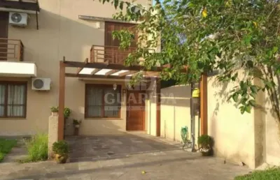Casa em condomínio fechado com 2 quartos à venda na rua bernardo profes, 70, hípica, porto alegre por r$ 400.000