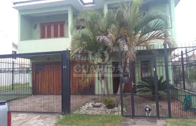 Casa com 3 quartos à venda na rua louro, 34, hípica, porto alegre por r$ 745.000