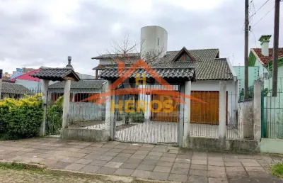 Casa com 4 quartos à venda na rua alfredo silveira dias, 36, nonoai, porto alegre por r$ 980.000