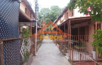 Casa em condomínio fechado com 2 quartos à venda na rua mura, 371, guarujá, porto alegre por r$ 198.000