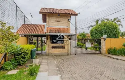 Casa em condomínio fechado com 2 quartos à venda na avenida edgar pires de castro, 1286, hípica, porto alegre por r$ 380.000