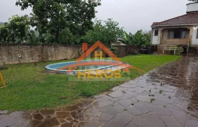 Casa com 3 quartos à venda na rua marquês do maricá, 168, vila nova, porto alegre por r$ 599.900