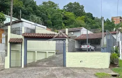 Casa com 3 quartos à venda na avenida vicente monteggia, 2406, cavalhada, porto alegre por r$ 495.000