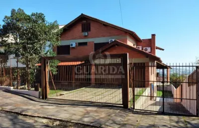 Casa com 6 quartos à venda na rua altos da amapá, 170, vila nova, porto alegre por r$ 2.800.000