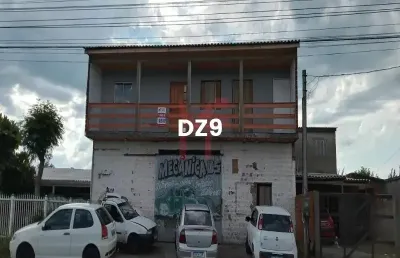 Sobrado com 02 aptos na parte superior + ponto comercial sendo uma oficina