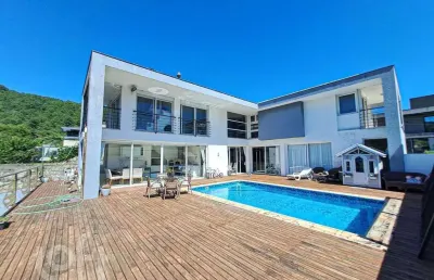 Casa em condomínio fechado com 4 quartos à venda na rodovia admar gonzaga, 3180, itacorubi, florianópolis, 343 m2 por r$ 3.900.000