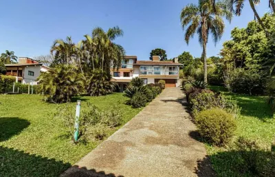 Casa em condomínio fechado com 4 quartos à venda na rua da amizade, 76, barro vermelho, gravataí, 450 m2 por r$ 2.500.000