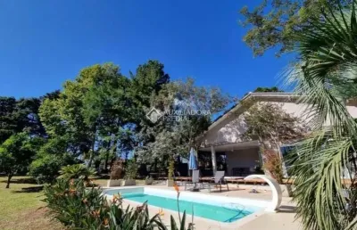 Casa em condomínio fechado com 3 quartos à venda na avenida ely corrêa, 9240, vila imperial, gravataí, 300 m2 por r$ 1.090.000