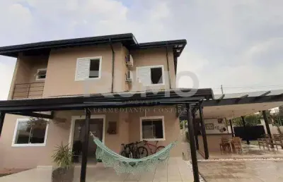 Casa em condomínio fechado com 3 quartos à venda na rua san conrado, 415, loteamento caminhos de san conrado (sousas), campinas, 344 m2 por r$ 1.800.000