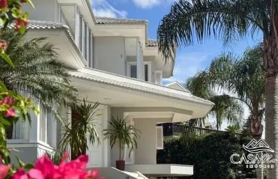 Casa em condomínio fechado com 4 quartos à venda na estrada haroldo soares glavan, 3450, cacupé, florianópolis por r$ 3.700.000