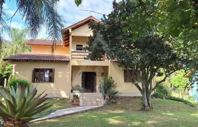 Casa em condomínio fechado com 5 quartos à venda na das goiabeiras, 130, morro grande, viamão por r$ 990.000