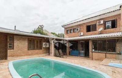 Casa com 3 quartos à venda na Rua Ramis Galvão, 223, Passo da Areia, Porto Alegre