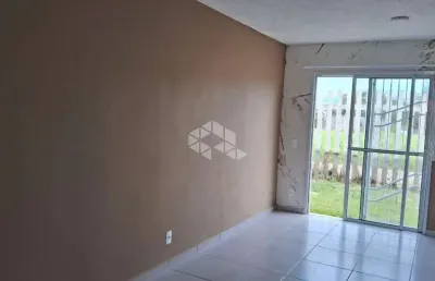 Icasa a venda com 02 dormitorios, sala cozinha conjulgados, banheiro, pátio , vaga de garagem, em frente a casa em condomínio fechado