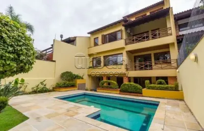 Casa em condomínio fechado com 4 quartos à venda na rua araruama, 558, chácara das pedras, porto alegre por r$ 3.000.000