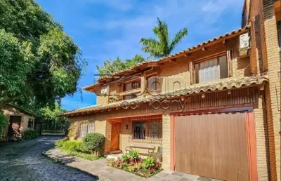 Casa em condomínio fechado com 3 quartos à venda na rua carlos júlio becker, 295, tristeza, porto alegre por r$ 860.000