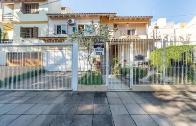 Casa em condomínio fechado com 4 quartos à venda na rua elias bothome, 118, jardim planalto, porto alegre por r$ 990.000