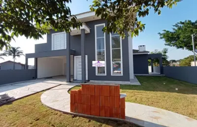 Casa com 03 suítes no melhor e mais bem localizado condomínio da região