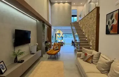 Casa com piscina e varanda gourmet à venda em condomínio.