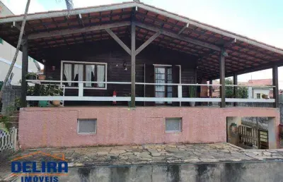 Encantadora casa de madeira: elegância e harmonia com a natureza