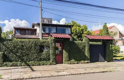 Casa com 3 quartos à venda na Avenida Guarujá, Guarujá, Porto Alegre