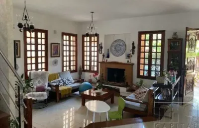 Casa para aluguel possui 420 metros quadrados com 4 quartos sendo 2 suites .