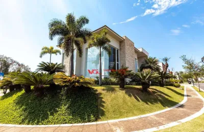 Casa de luxo com 04 suítes, fino acabamento e piscina com prainha à venda, 760 m² por r$ 7.400.000 - jardim vila paradiso - indaiatuba/sp