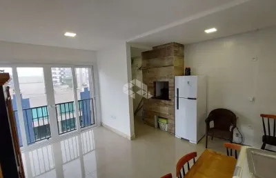 Sofisticação e vista para o pôr do sol: apartamento novo com 2 dormitórios  com suíte no centro de capão da canoa.