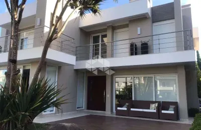 Sobrado de luxo no condomínio las dunas, xangri-lá - 4 suítes, piscina privativa e 350m² de sofisticação