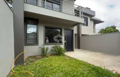 Casa 3 dormitórios, suíte, varanda, piso porcelanato, vaga coberta, churrasqueira, bairro pátria nova em novo hamburgo