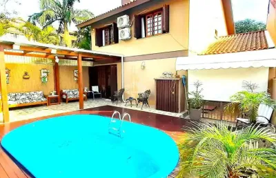 Casa com 4 quartos à venda na Rua Ari Peixoto Martins, 190, Ipanema, Porto Alegre