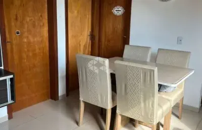 Apartamento a venda de 2 dormitórios semimobiliado em condomínio com vaga na restinga.