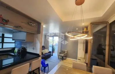 Apartamento semimobiliado com 2 quartos sendo 1 suíte.