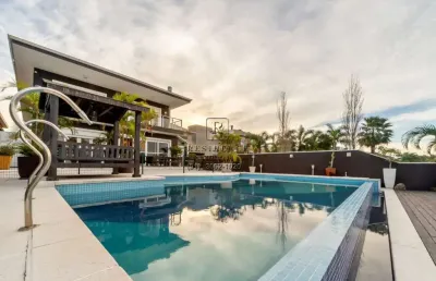 Impecável casa em condomínio à venda com 4 dormitórios, 550m² e 4 vagas no bairro terra ville em porto alegre-rs