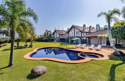 Casa em condomínio fechado com 5 quartos à venda na avenida juca batista, 8000, belém novo, porto alegre, 650 m2 por r$ 7.000.000